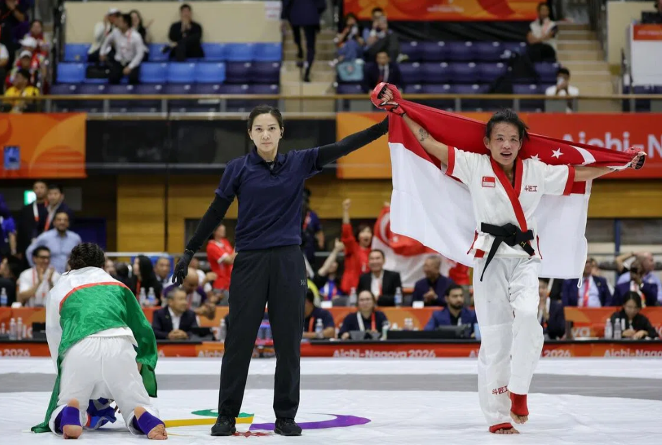 Gold medallist Tiffany Teo (second from left) of Singapore with (from left) silver medallist Khilola Sobirova of Uzbekistan, and bronze medallists Cheng Dalin of Cambodia and Suchika Tariyal of India at the Nagoya City Inae Sports Centre on Sept 22. - ST/KEVIN LIM