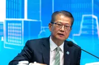 Hong Kong’s Paul Chan rejects ‘race to bottom’ with Singapore