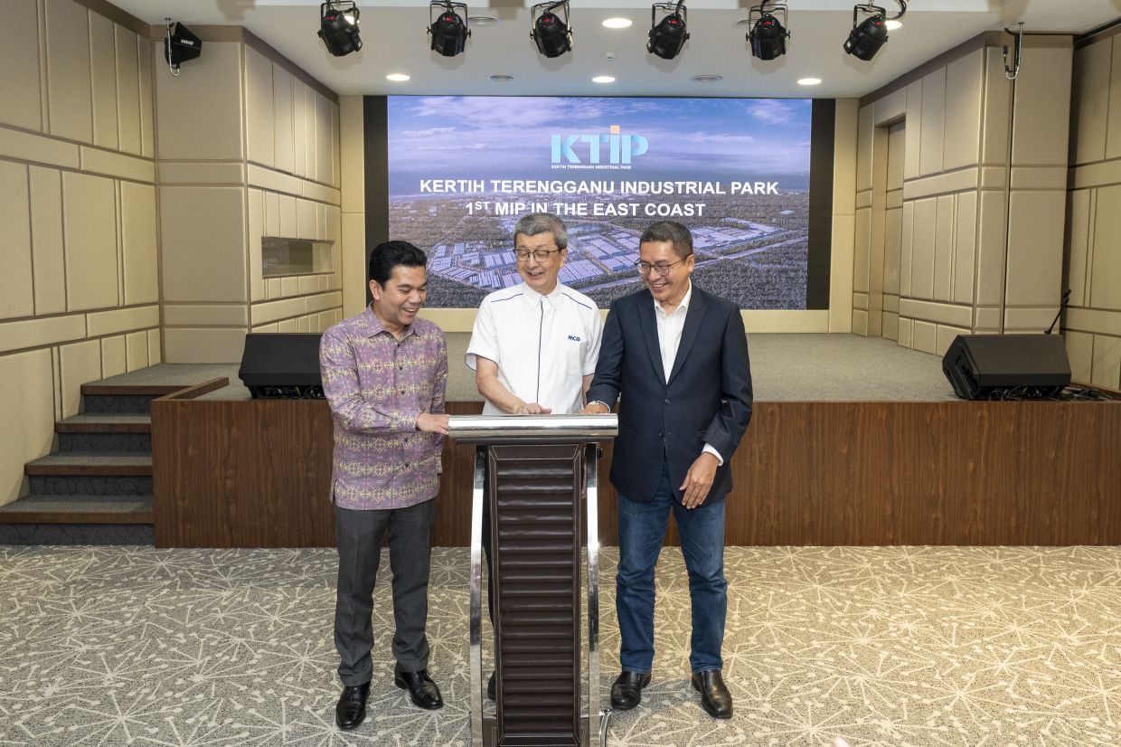 Strategic collaboration: Faizal, Hock San and Awasi at a collaboration ceremony to promote KTIP to domestic and international investors.