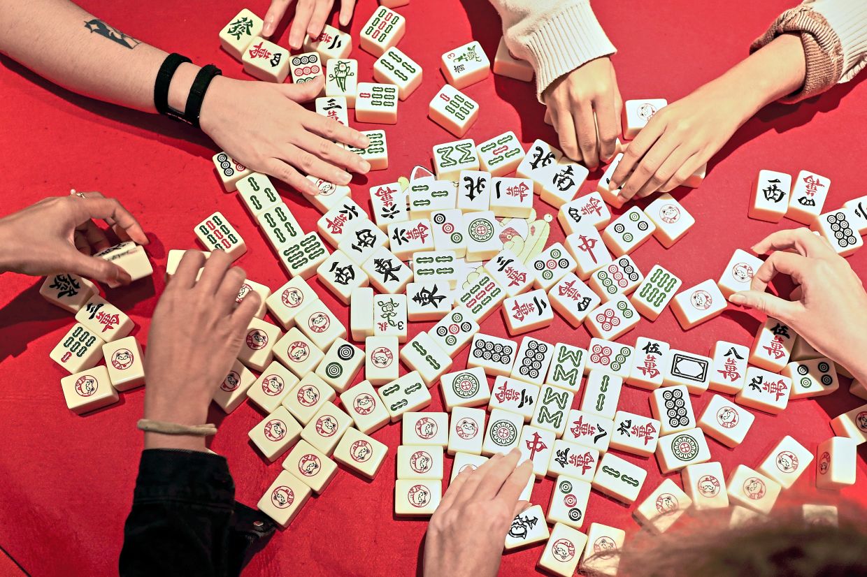 It's common to see people who come to Jom Mahjong start off as strangers but leave with new friends. Photo: The Star/Yap Chee Hong