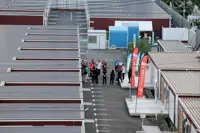Games-Organisers defend Asian accommodation as residents question cramped huts