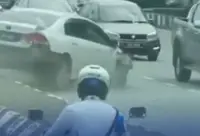 QuickCheck: Was a car caught on video climbing a divider to drive against traffic in Ipoh?