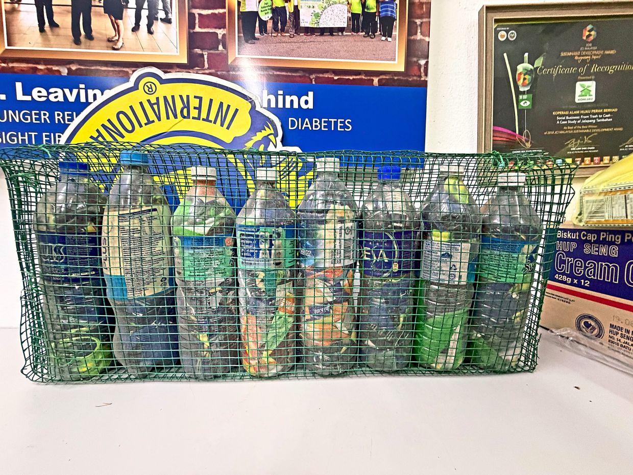 Example of plastic waste inserted into mineral bottles for reuse as eco-bricks.