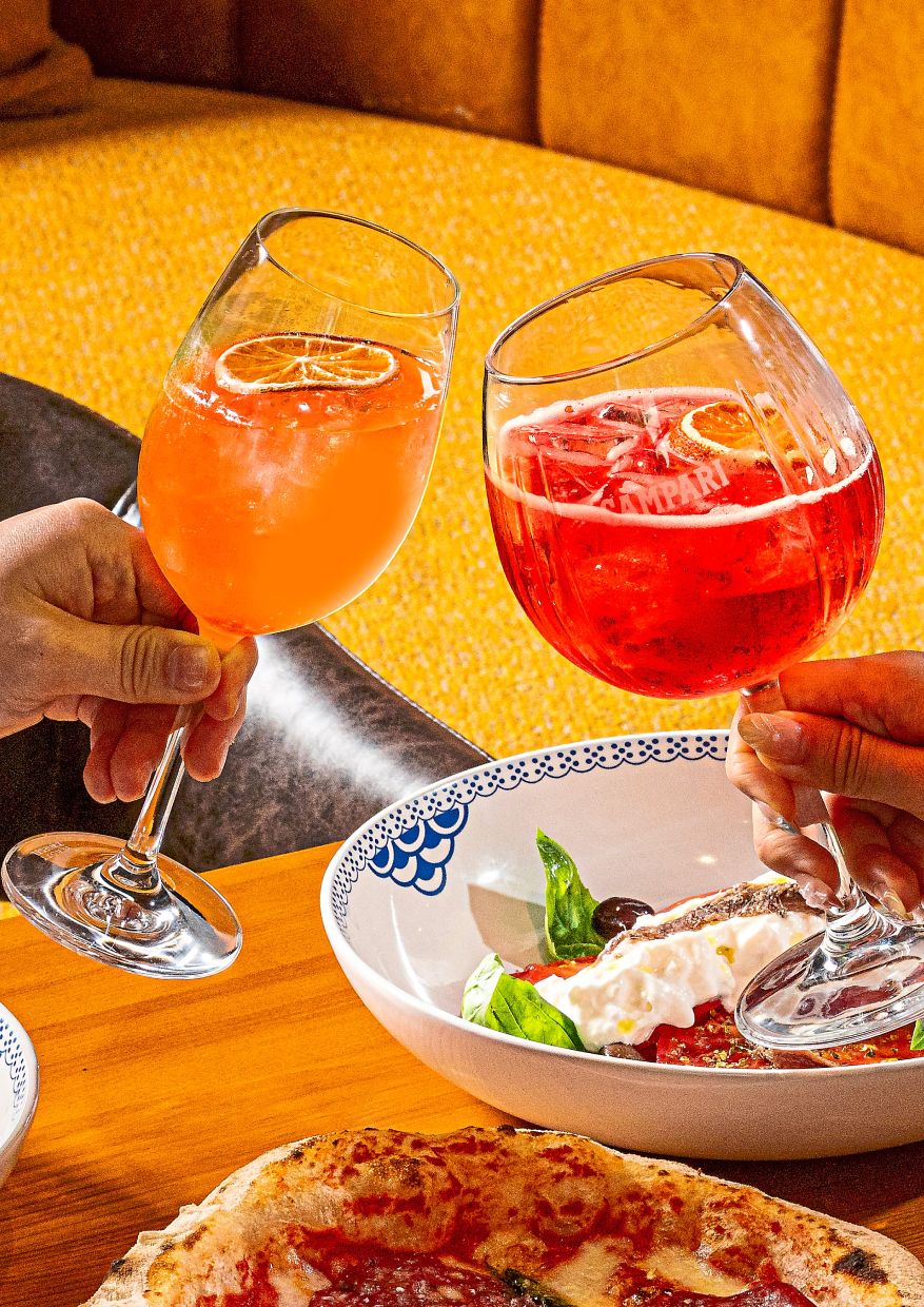 Free flow of Aperol Spritz (left) and Campari Spritz @21 Rooftop Bar.