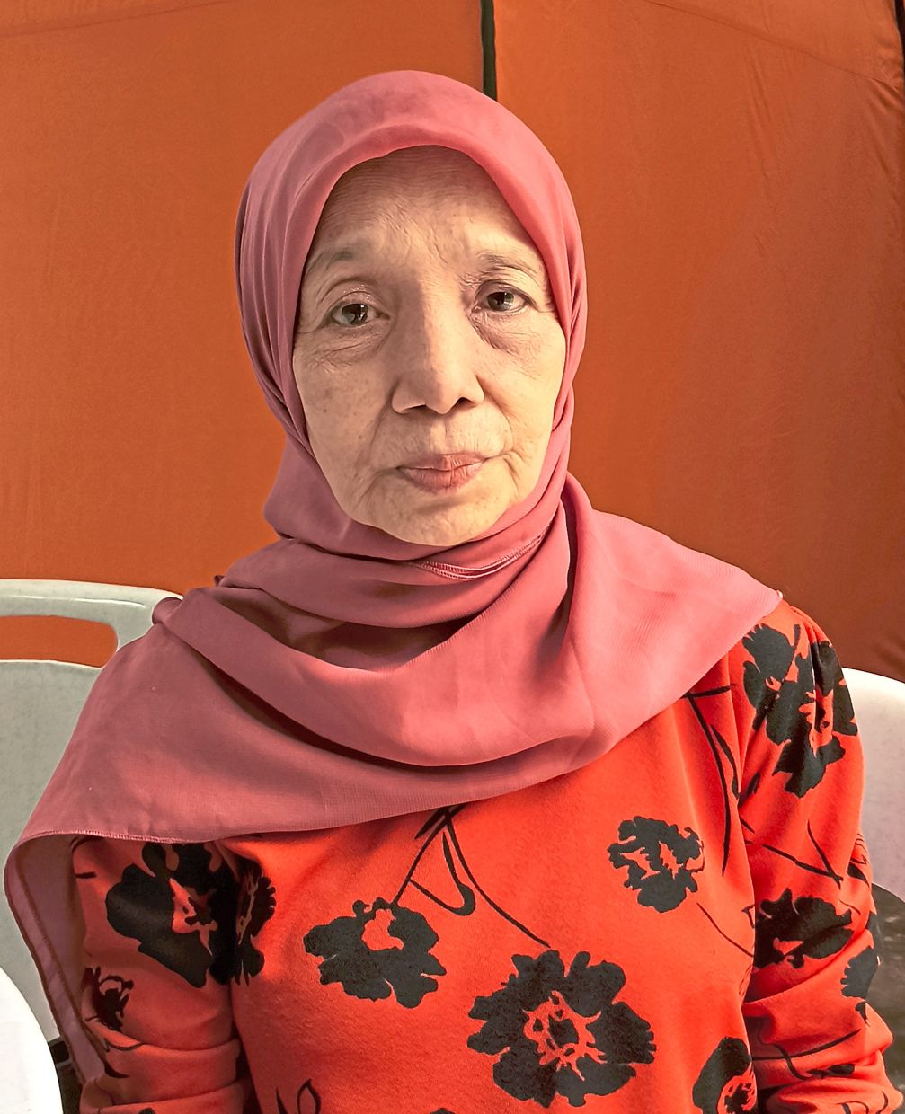 Absah is eager to go home so she can care for her grandchildren.