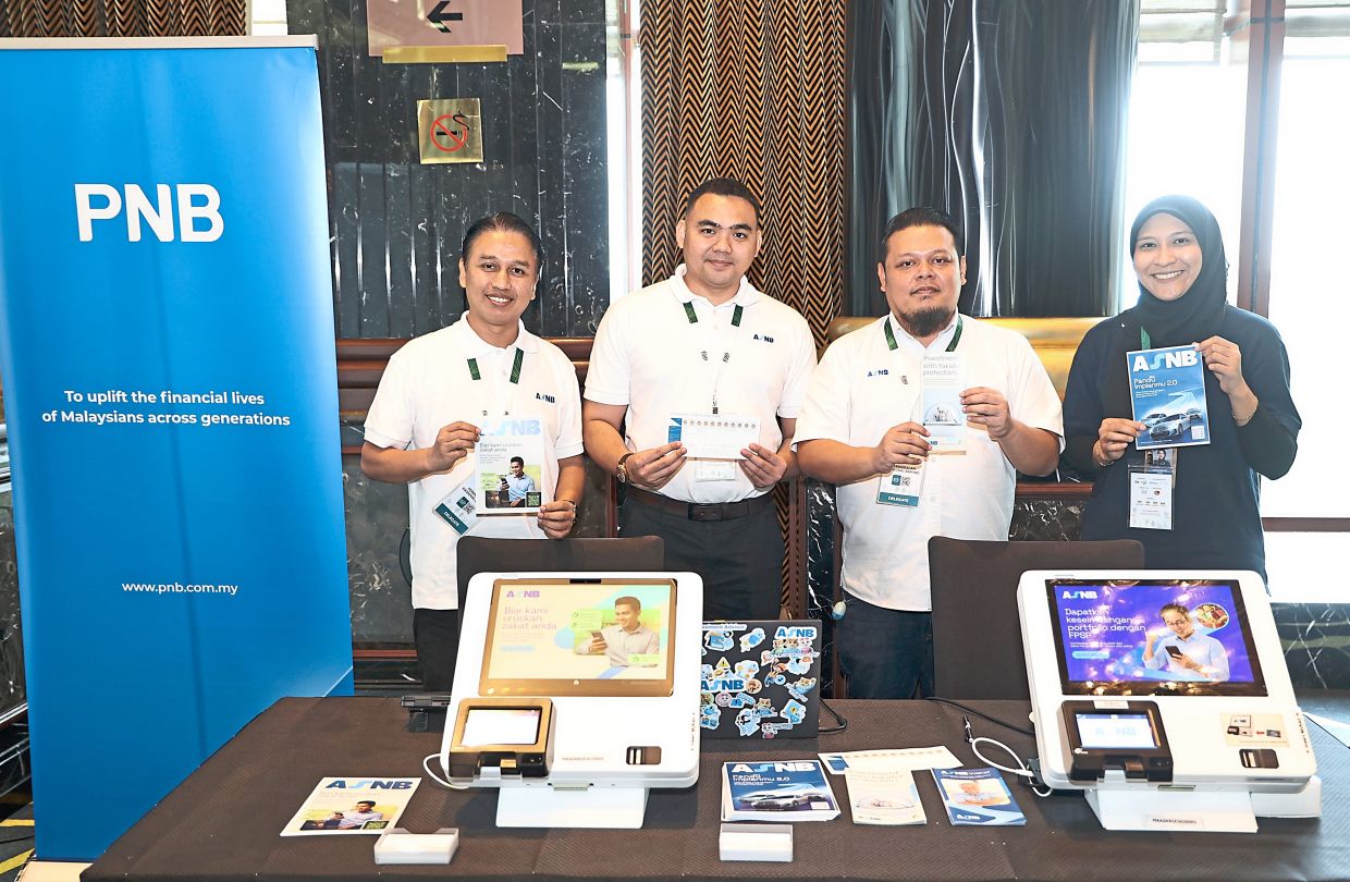 ASNB representatives showcasing products and services at the PNB booth during the Asia ESG Summit 2026, for which PNB served as a supporting partner. ASNB is a subsidiary, wholly owned by PNB.