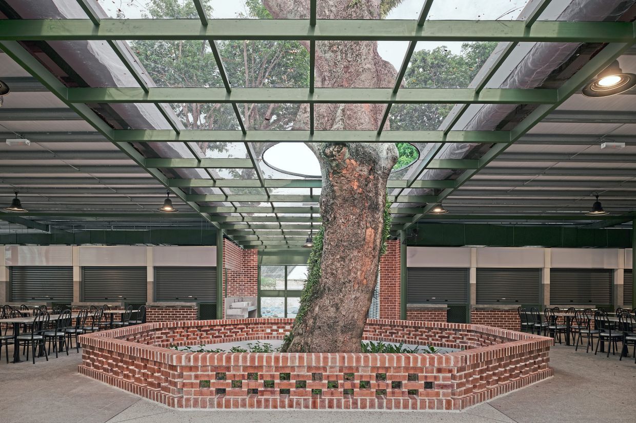 Two mature existing trees are retained and incorporated into the building.
