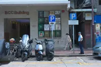 Hong Kong police search for woman after man found dead outside building