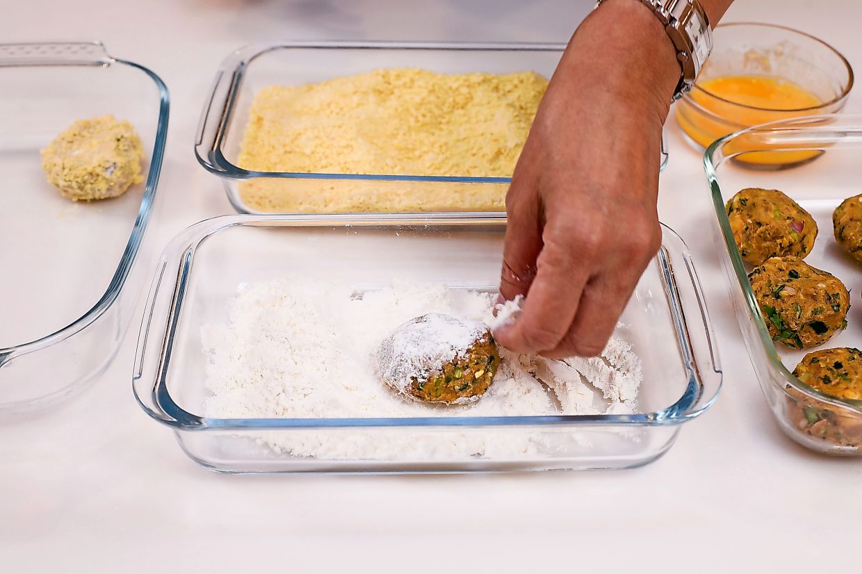 Dredge the cutlet in flour, egg and the cornflakes – in that order.