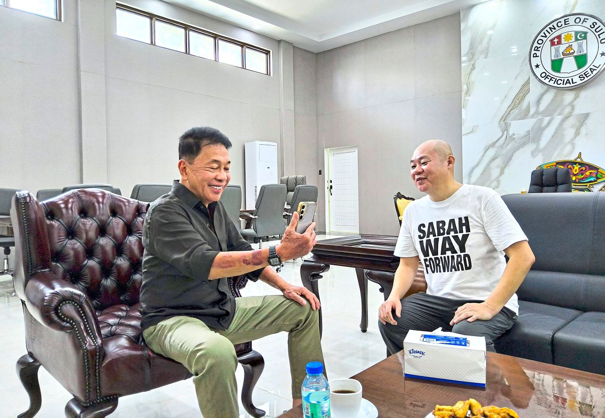 Sakur Tan with the writer during his video call with Yong, who came away from the talk reassured that the security in Sulu and the broader Southern Philippines has improved. — PHILIP GOLINGAI/The Star