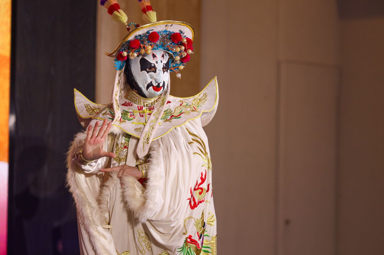 Traditional Chinese Bian Lian face-changing performance brings DMCGG's Moon of Compassion 2026 celebration to life at the event.