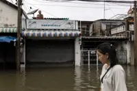 Heavy rain and flooding in Bangkok disrupts traffic and prompts evacuations