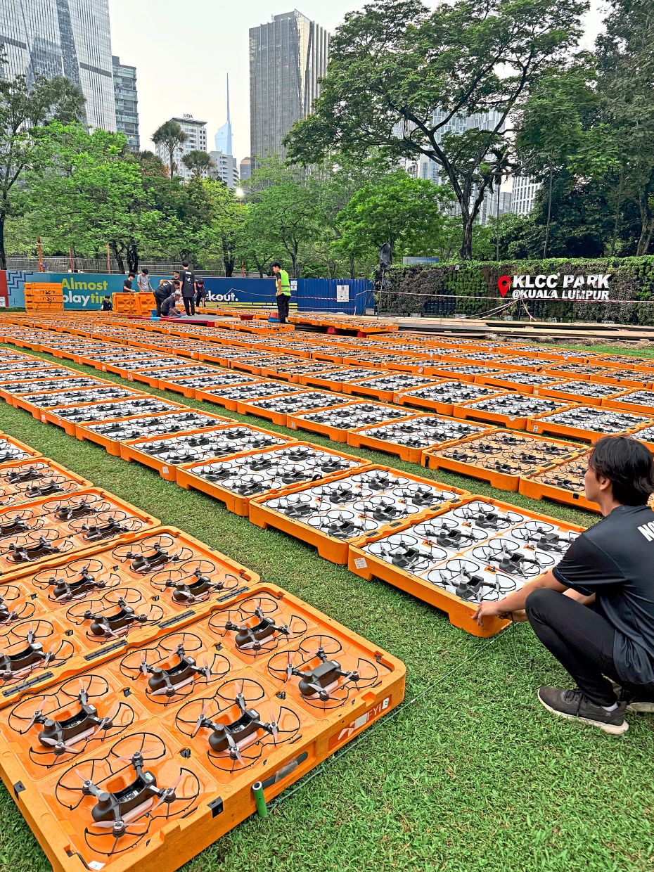 A ground crew setting up for the Merdeka drone show at KLCC park. — Novas Drone