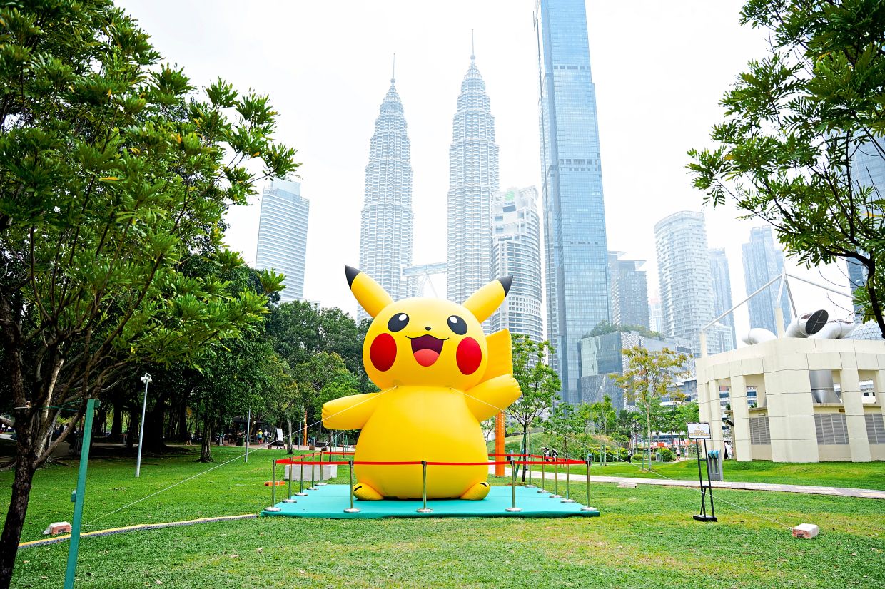 Cuteness to the max with a larger-than-life Pikachu and the PETRONAS Twin Towers in the background.