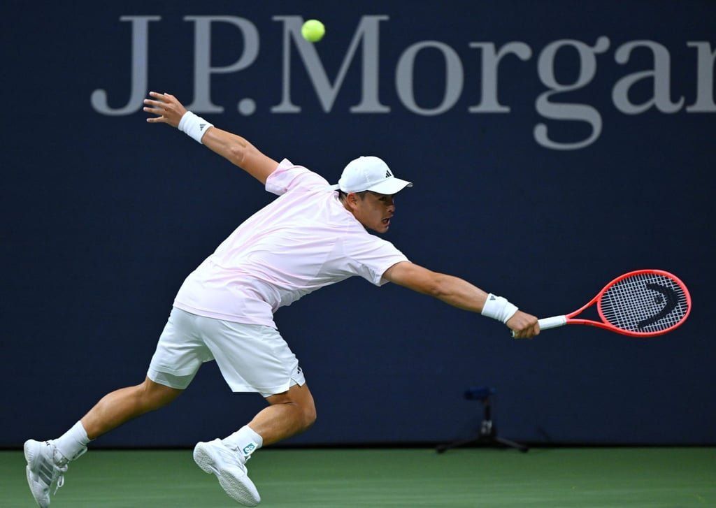 China’s self-proclaimed “hunk”, Wu Yibing, hits a return during a second-round match against Australia’s James Duckworth at the US Open in New York on September 2. -- Photo: Xinhua