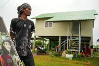 In Cambodia's 'Waiting Village', tattoo artist mourns trade lost to war
