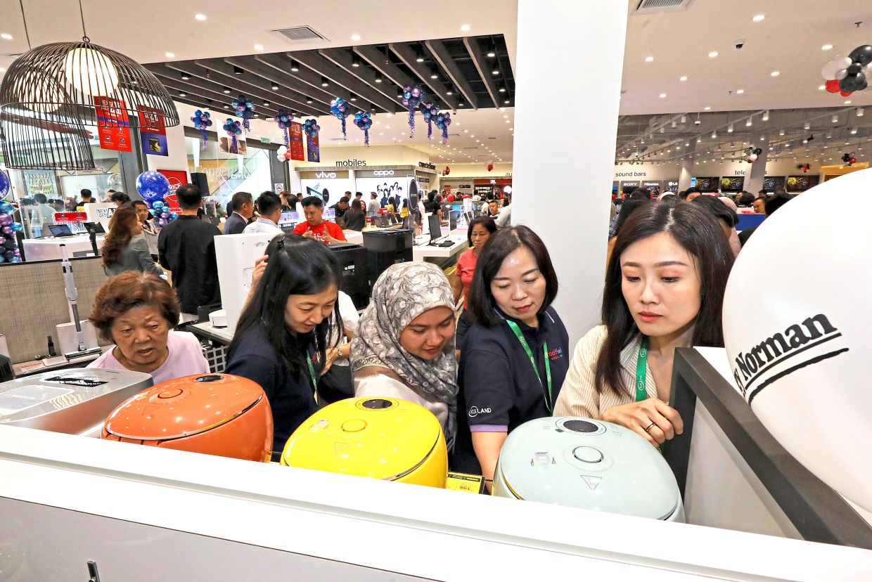 Shoppers checking out bargains at the grand opening sale.