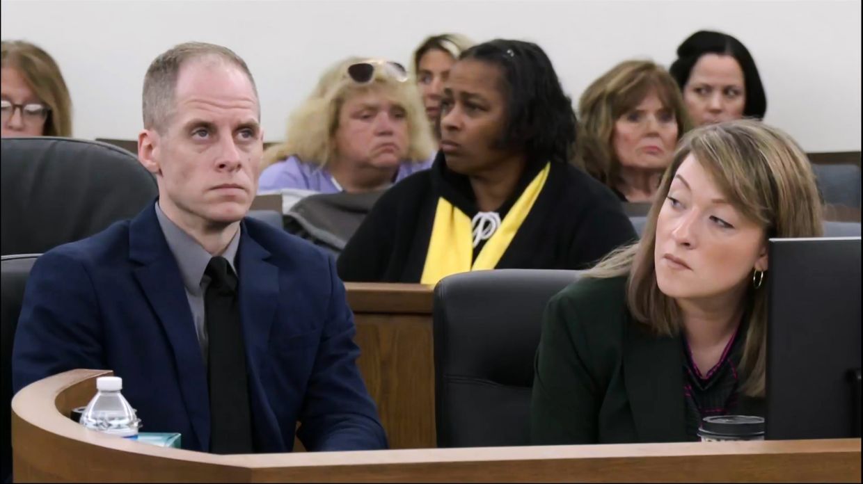 Caleb Flynn (left) sits next to Emily Smith, right, one of his attorneys. Photo: AP