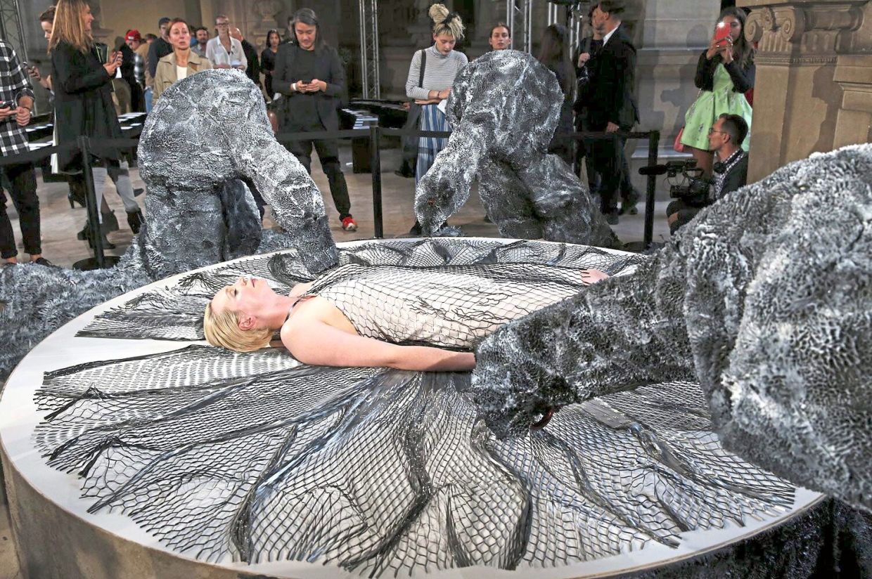 Actress Gwendoline Christie wears a dress that is live printed upon her during the Spring/Summer 2016 Paris Fashion Week. Photo: Iris Van Herpen
