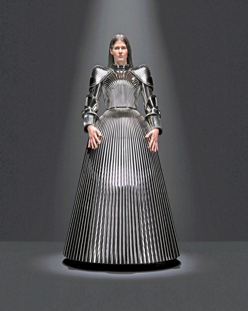 Rigid and reflective, this 3D-printed dress from 2023 fuses classical techniques with cutting-edge advancements. Photo: Balenciaga