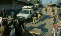 Officers killed in suspected militant attack on police vehicle in north-west Pakistan