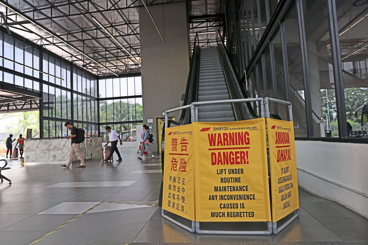 The escalator that is currently under repair at the terminal.