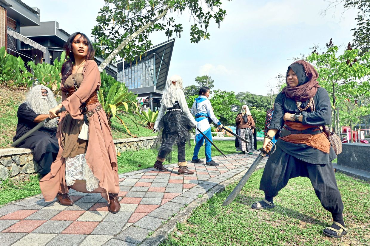 Cosplayers striking poses for the live-action role-playing during Ren Faire at TMIYC Johor Baru.