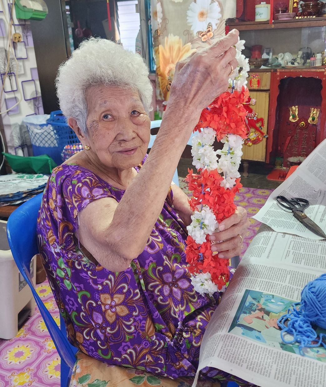 For Cheong, purpose can be found in the simplest thing, like a handful of flowers carefully strung into a temple garland.