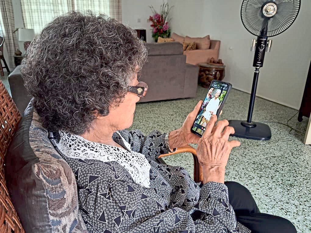 Tan is still adept at using her smartphone, keeping in touch with family through WhatsApp video calls.