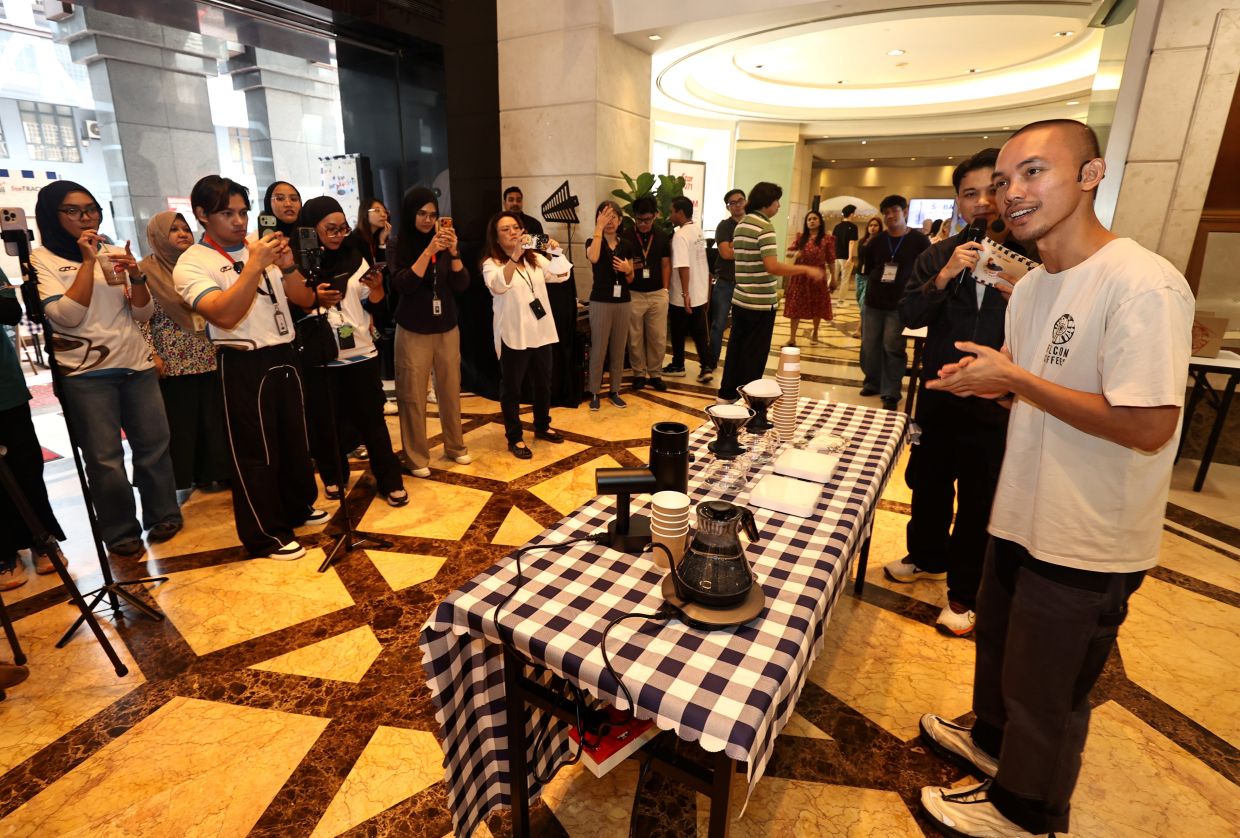 World Brewers Cup 2026 champion Nas Jaafar (right) explaining the intricacies of coffee during his Barista Talk during the event. - Photo: AZMAN GHANI / The Star
