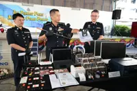 Penang cops nab 29 foreigners in ‘scratch-and-win’ scam raids