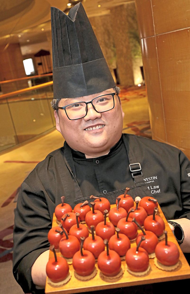 Low with his signature Cherry Velvet Mousse dessert.