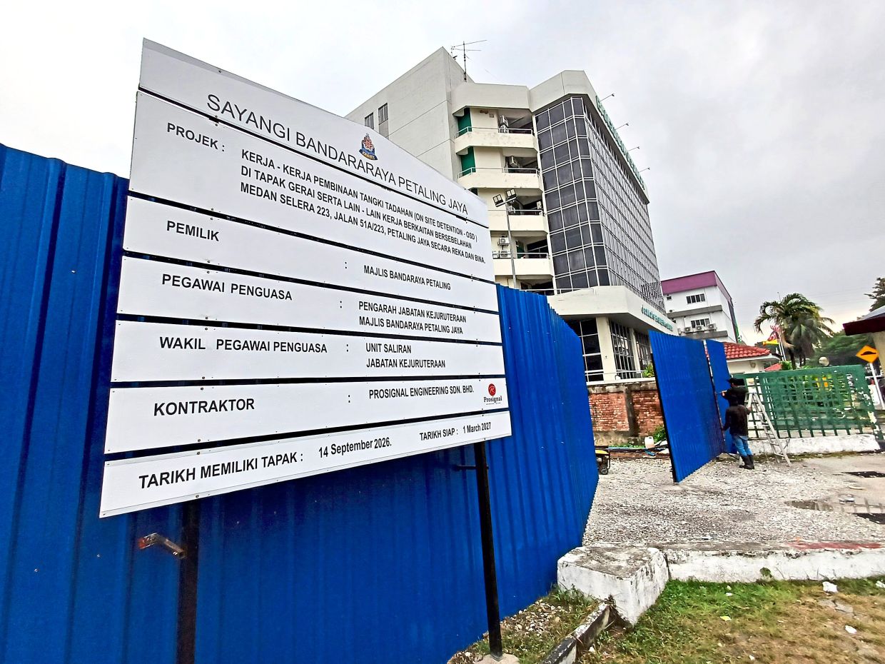 Signboard for the on-site detention pond project to be located at an empty lot next to the food court.