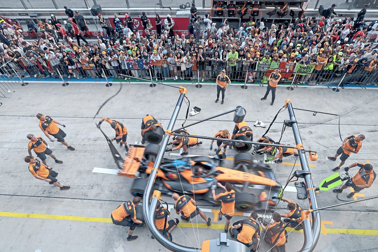 Need for speed: McLaren mechanics practising at the pit stop ahead of the Formula 1 Gulf Air Bahrain Grand Prix. — GLENN GUAN/The Star