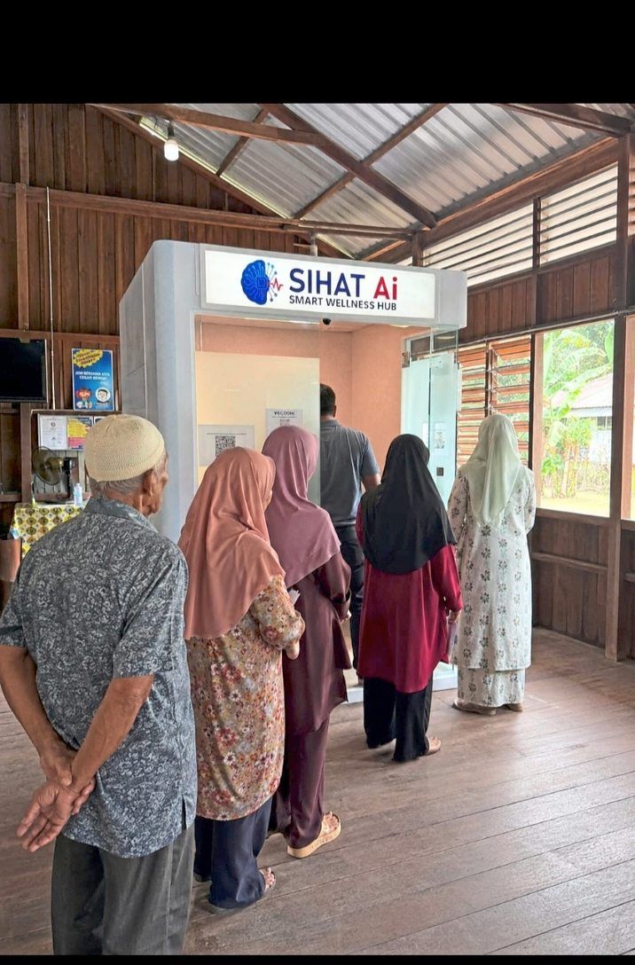 Villagers in Perak queueing up at the Sihat AI kiosk that supports rural communities by bringing AI-enabled health screening, monitoring and telemedicine closer to the people.