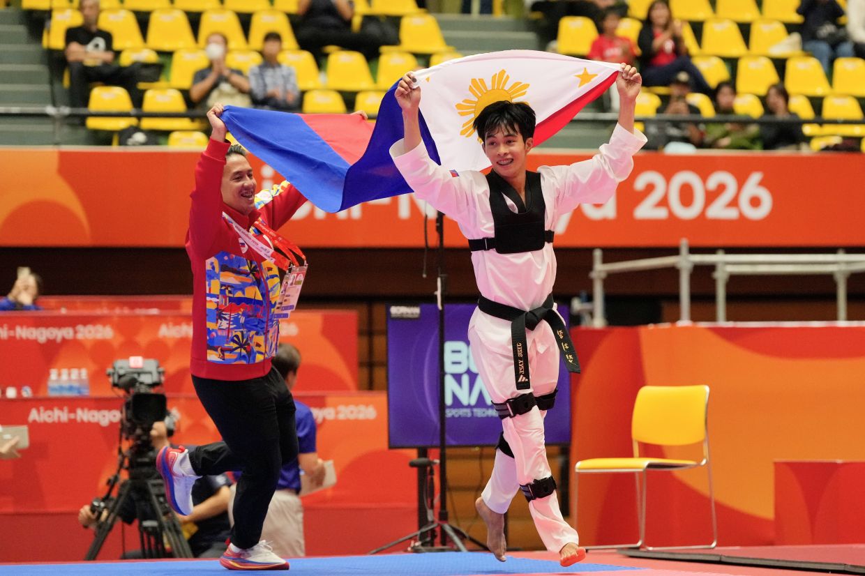 Philippines' Jeus Gabrial Derick Yape celebrates after winning his mixed individual virtual taekwondo final match against Vietnam's Chau Ngoc Tuyet Sang at the Asian Games in Toyohashi, Japan, on Friday, Oct 2, 2026. -- AP Photo/Dita Alangkara