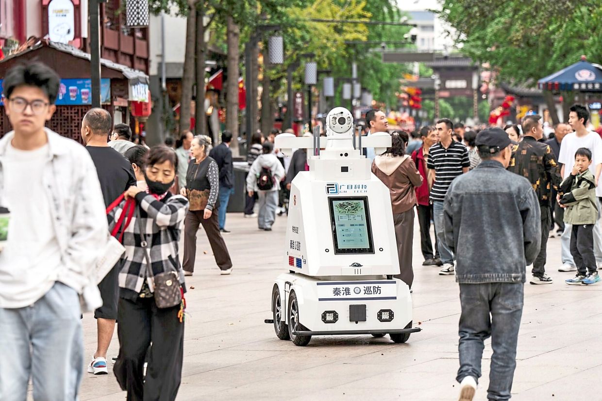 An autonomous police patrol robot roaming the streets in Nanjing. — Bloomberg
