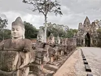 Cambodia reattaches two ancient deity statue heads at Angkor Thom's gate in Angkor complex
