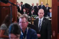As public fears of AI grow, Trump digs in on voluntary safeguards