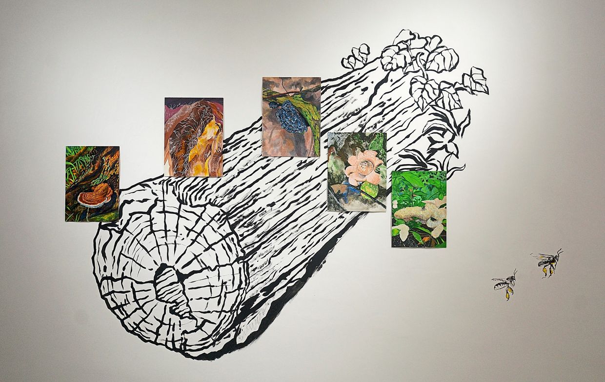 Hasanul’s 'The Underground Networks 3' mural shows a log he encountered at his Selama studio, while small paintings on paper depict the different species of mushrooms and insects living on it. Photo: Jeremy Tan 