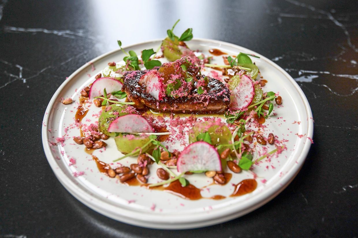 Yew has given the rich, velvety foie gras a tropical edge, courtesy of the torch ginger flowers grated atop it.