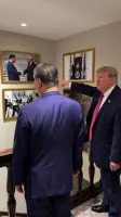 Xi has left Washington, but remains in Trump’s photos on White House walls