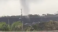 Rare tornado rips through Australian town