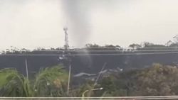 Rare tornado rips through Australian town