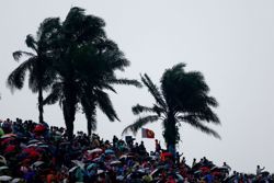 Motor racing-Bahrain Grand Prix in Sepang delayed due to heavy rain