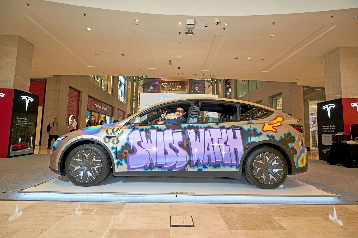 The Swiss Watch x Cloakwork collaboration uses a Tesla as a canvas for graffiti art. (Below) Zenith’s interactive demonstration during the exhibition.