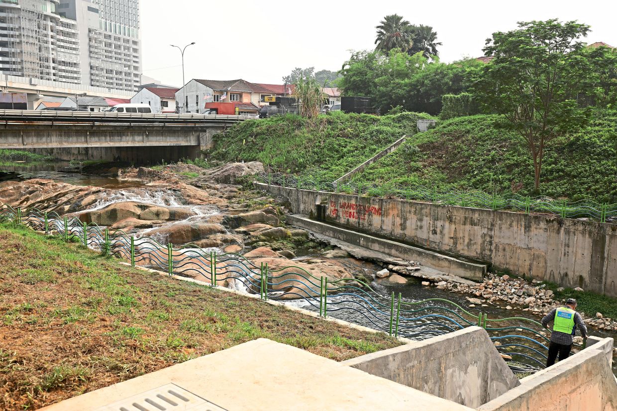A view of the new open drain (right) installed as part of repairs and riverbank strengthening.