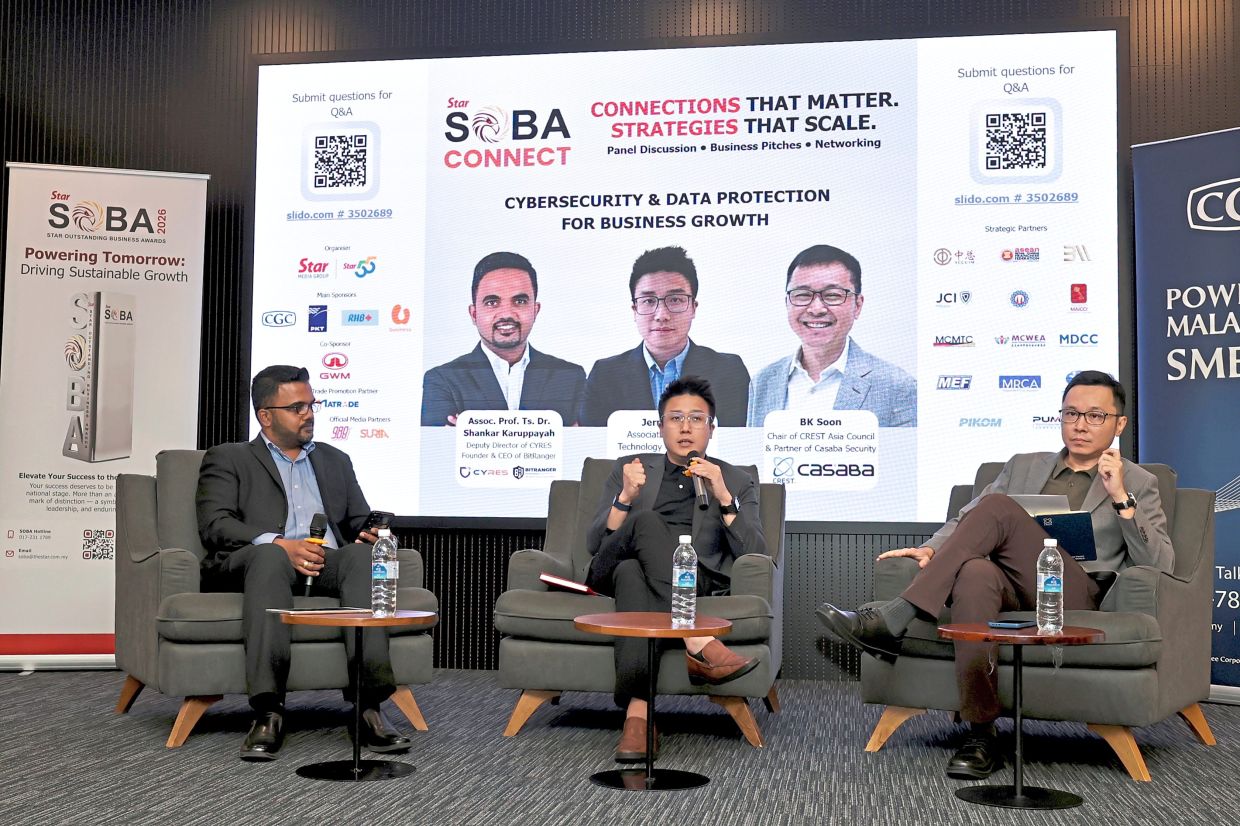 Greater security: Ng (centre) responds during the panel session on cybersecurity with Shankar (left) and Soon (right).