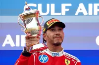 Lewis rides out storm