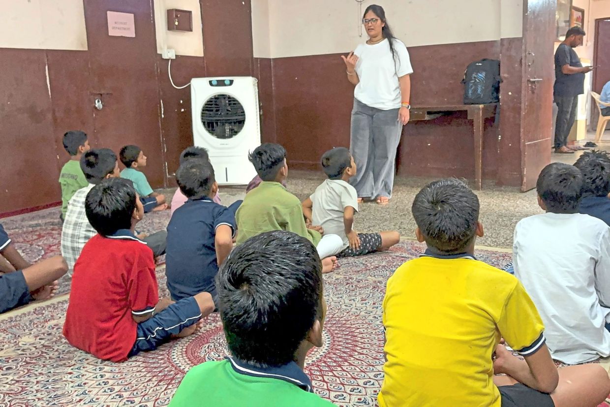 Children attend a lesson at a shelter for street children in New Delhi. Photo: Dirk Godder/dpa
